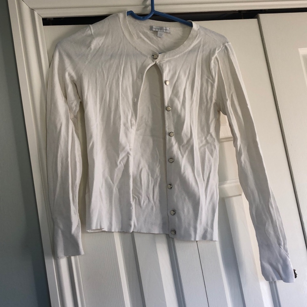 White sweater. Cute Button Detail. Size XS.
